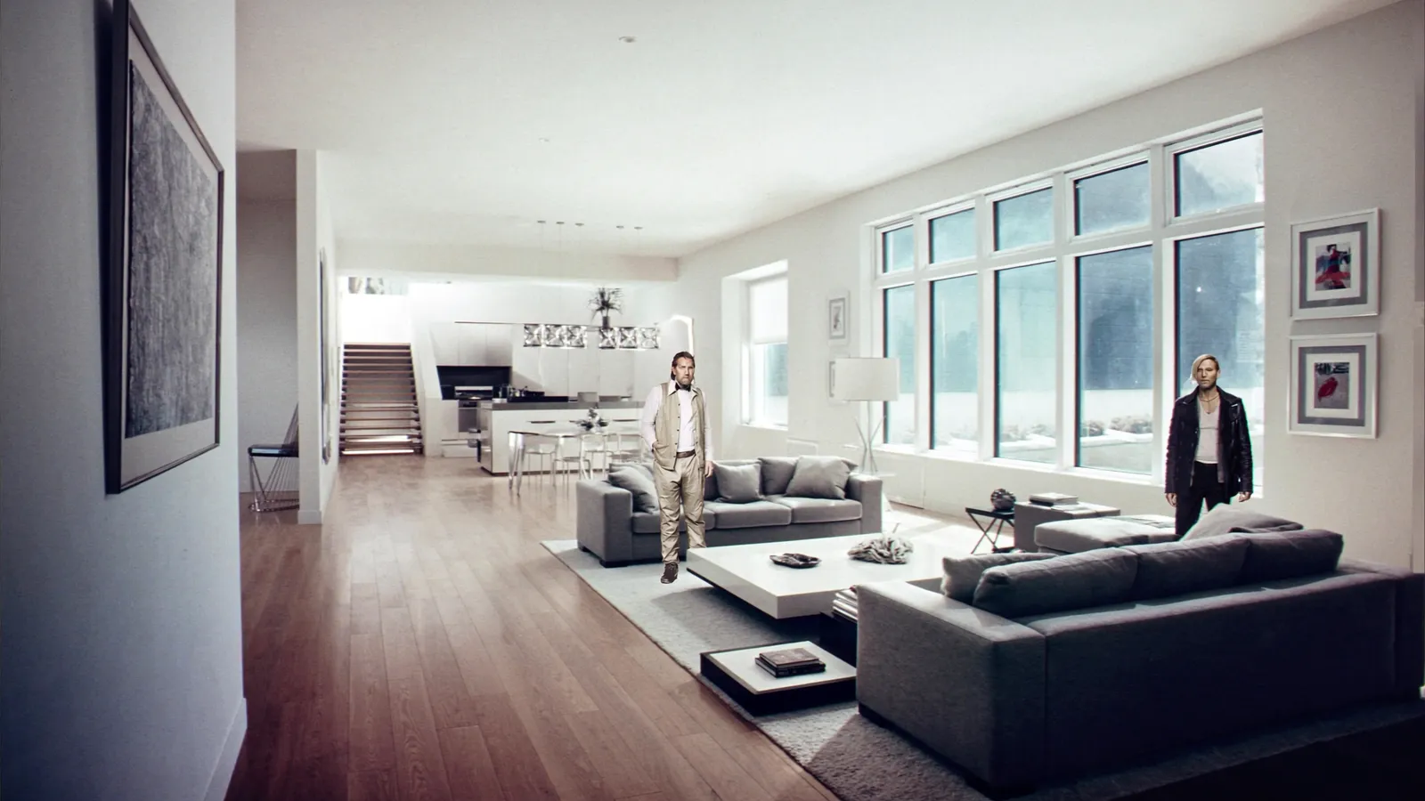 A staged luxury living room with an open floor plan and large windows