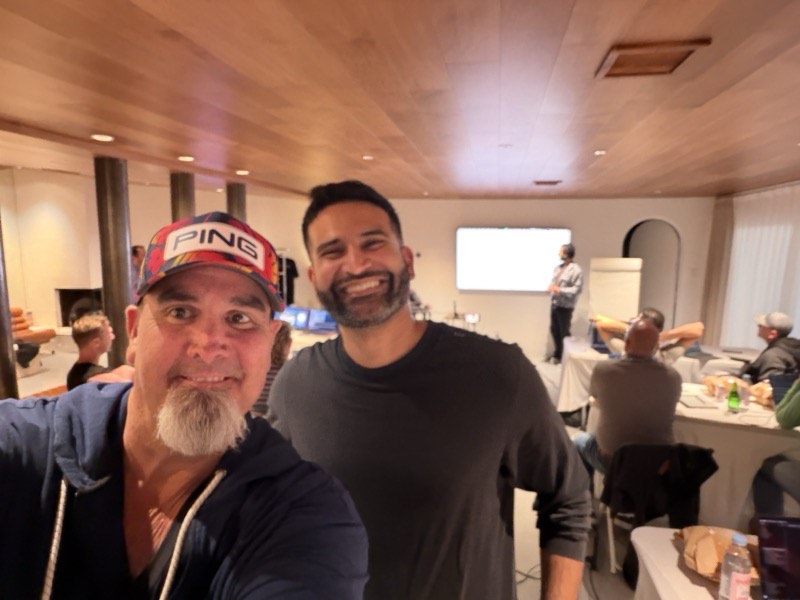 Two people standing together in the working room.